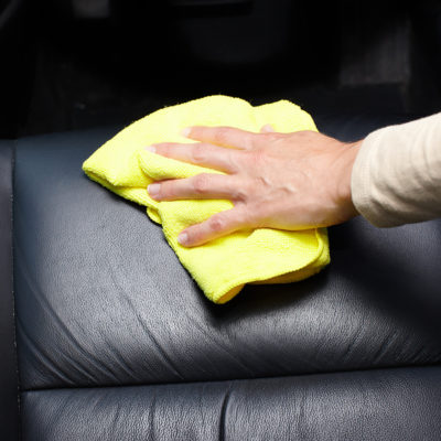 bigstock-Hand-cleaning-car-seat-49817048